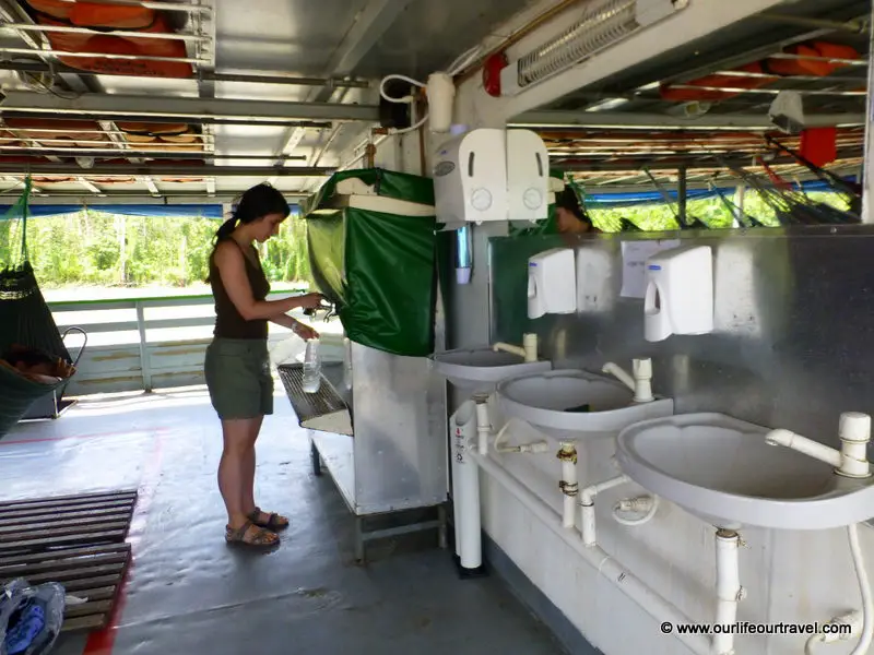 Drinking water on the boat. Tabatinga - Manaus boat ride