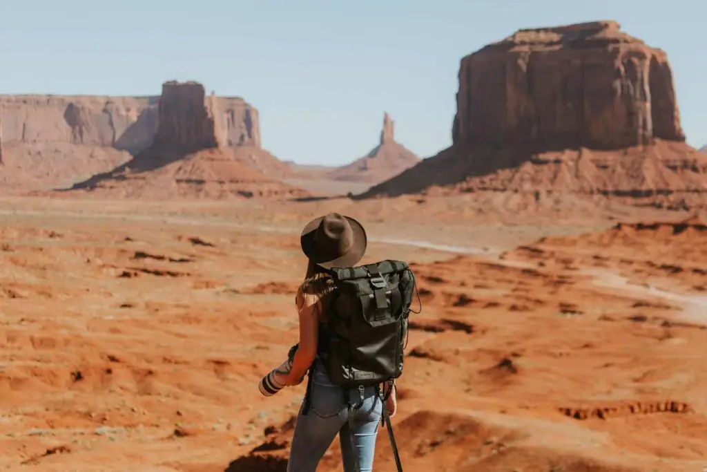 Hiking with backpack in Oljato-Monument Valley, United States